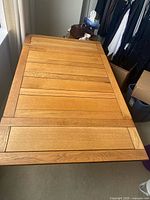 Table fully assembled showing wood grain and panel layout