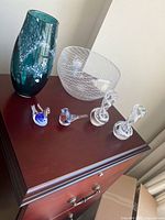 Group showing all seven glass items on furniture top