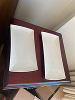 Top view of both nesting platters showing size difference and diamond texture