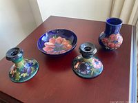 Full view of all four Moorcroft pottery pieces