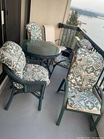 Patio table with five chairs on balcony