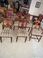 Eight of the chairs arranged in rows showing style and upholstery