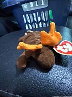 Side view showing full plush, antlers, swing tag