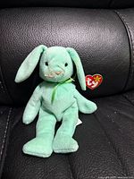 Front view of mint green Hippity rabbit Beanie Baby with Ty tag
