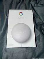 Front of retail box showing Google Nest Mini 2nd Generation