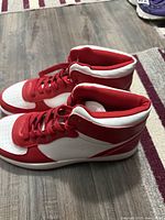 Side view of red and white high-top pair