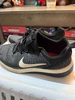 Side view of both shoes showing uppers and swoosh logo