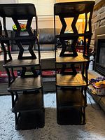 Front view of the two identical 5-tier racks showing shelves and side supports