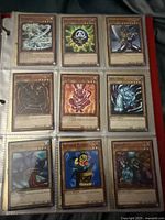 First binder page with nine assorted Yu-Gi-Oh! monster cards such as Tongyo and Rainbow Flower
