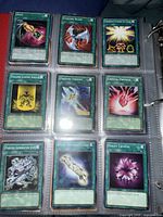 Nine Spell cards in binder page
