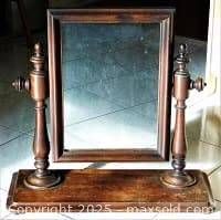 Front view showing full mirror, frame, side supports and base