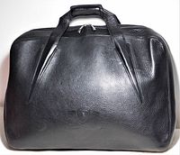 Front view of black Lamborghini leather travel bag showing handles and crest