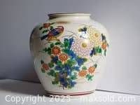 Full view of Kutaniyaki vase showing shape and painted motifs