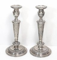 Front view of both sterling candlesticks