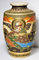 Front view of Satsuma vase showing main robed figure and enamel detail