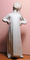 Full frontal view of Lladro Girl With Arms Akimbo figurine