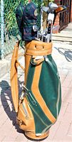 Full left side view of Wilson Professional green and tan golf bag