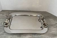Top view of rectangular metal tray showing entire surface and handles