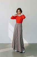 Model wearing palazzo-leg dress