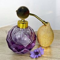 Front view of amethyst crystal perfume atomizer showing overall design