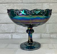 Full view of blue iridescent carnival glass pedestal bowl on pedestal base