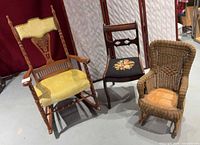 Group view of three vintage chairs: wood rocking chair, wood side chair, wicker child rocker