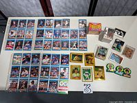 Overview of all cards including sealed box, card brick, binder sheets, loose stacks and novelty cards