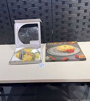 Cheese serving set box beside Mikasa platter box