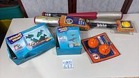 Group shot of all items: two Wonder World aquarium kits, two Vortex bats, Vortex two-pack orange balls, Vortex yellow ball