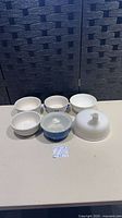 All five items displayed together: two white Caféware bowls, Chicken Soup bowl, Sawyer bone china bowl, milk glass juicer attachment