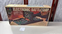 Front of boxed Electronic Battleship showing artwork and branding