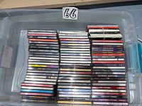 Top view of tote containing stacked CDs bound with rubber bands