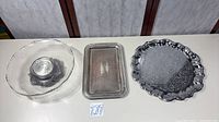 Overview of all three pieces: glass cake stand, rectangular tray, round platter