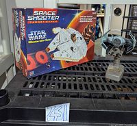 Boxed Space Shooter set and TIE Fighter on shelf