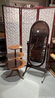 Cheval mirror and 3-tier table together