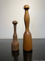 Both wooden mashers side by side