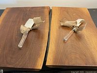 Two wooden boards with cleaver placed on each