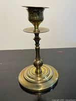 Round-base brass candlestick close-up