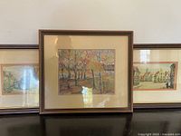 All three framed artworks grouped together