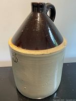 Front view showing entire 5 gallon stoneware crock jug