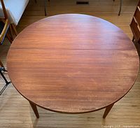 Round teak table top closed