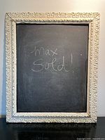 Full view of chalkboard displaying frame and writing surface