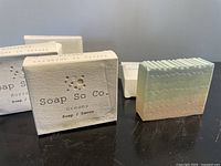 Front view showing boxed and unboxed Soap So Co. bar soaps