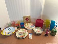 Full lot overview showing tableware and decor items arranged on table