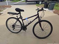 Left side view of Grand Teton FS Elite bicycle with rear rack, kickstand, bell, reflectors