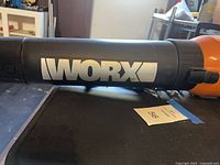 Close-up of WORX logo on blower barrel
