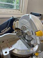 Overall view of Mastercraft Maximum miter saw showing blade guard, dust bag, miter table and handle