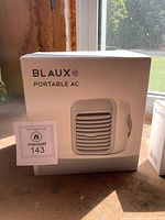 Front of boxed BLAUX Portable AC