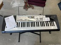 Keyboard on stand with manual visible