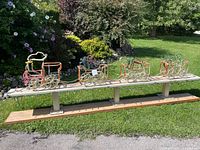 Full side view of four-piece rope-light train on base